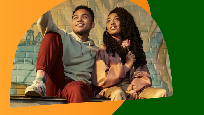 teenage boy and girl sitting next to each other