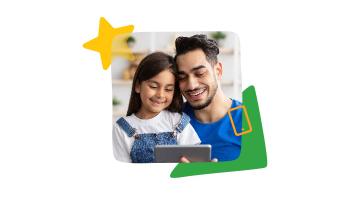 man and young girl smile looking at a cell phone